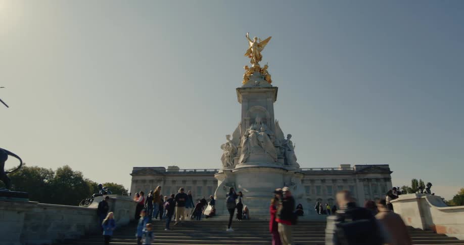 Square with a classical statue surrounded by people