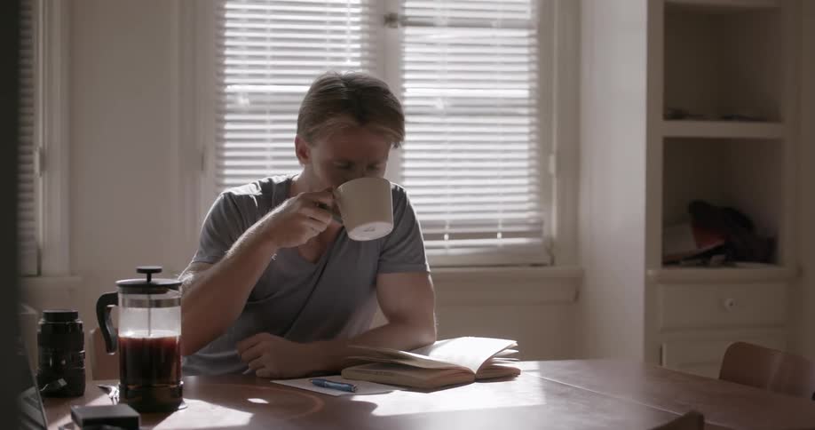 A man pours a cup of coffee