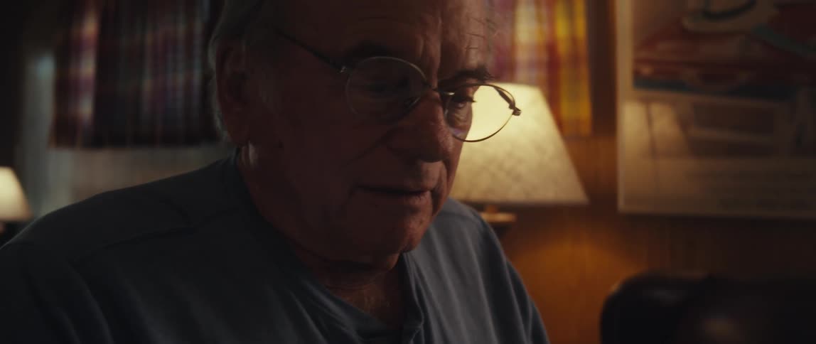 A clip of an elderly person having a conversation on a laptop