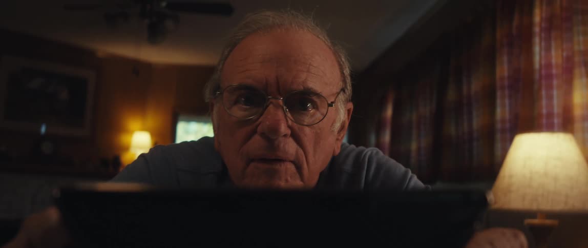 Point of view of an elderly man getting surprised while interacting with a tablet