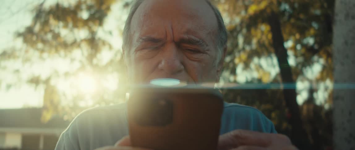 A clip of an elderly man operating a smartphone