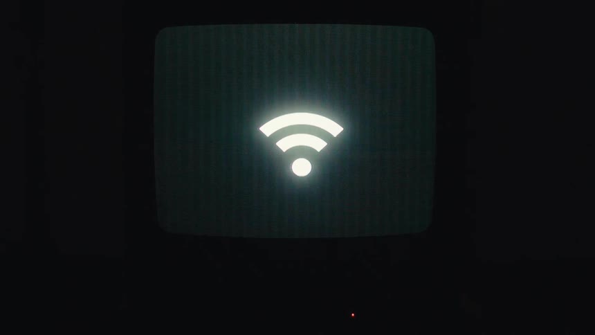 Wifi signal flashing against black background