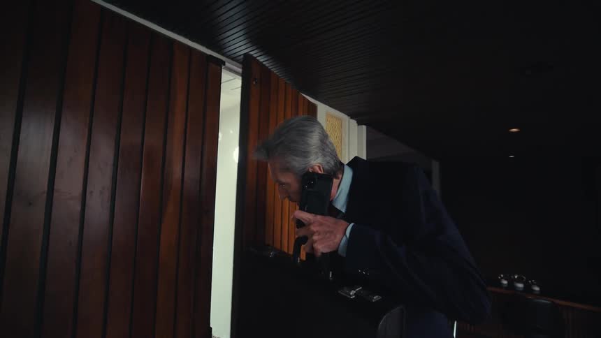 Man entering house while on a phone call
