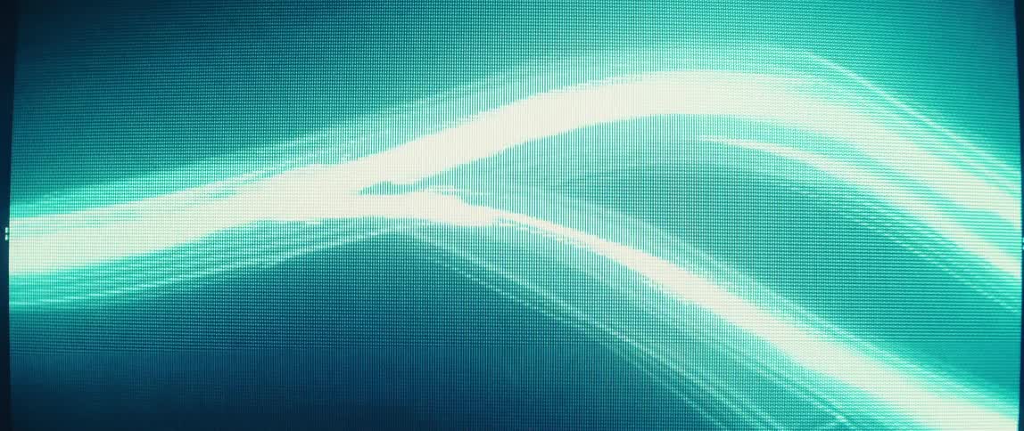 A screensaver is running on the screen