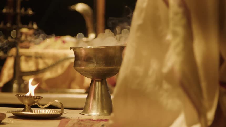 Golden chalices rising in smoke