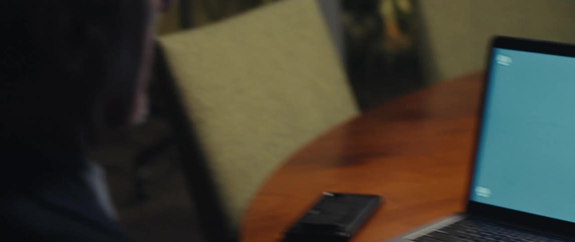 Man sitting typing on a laptop