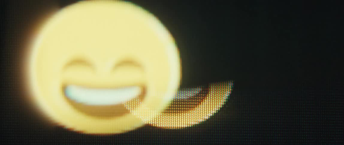 A smiley face moves on the screen