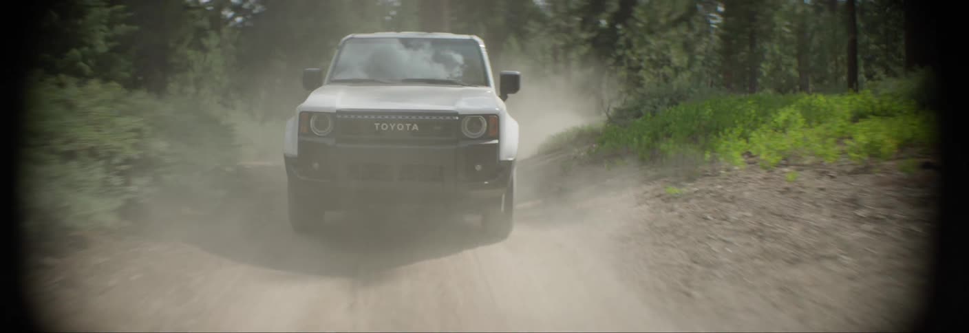 White toyota offroad vehicle driving along a trail