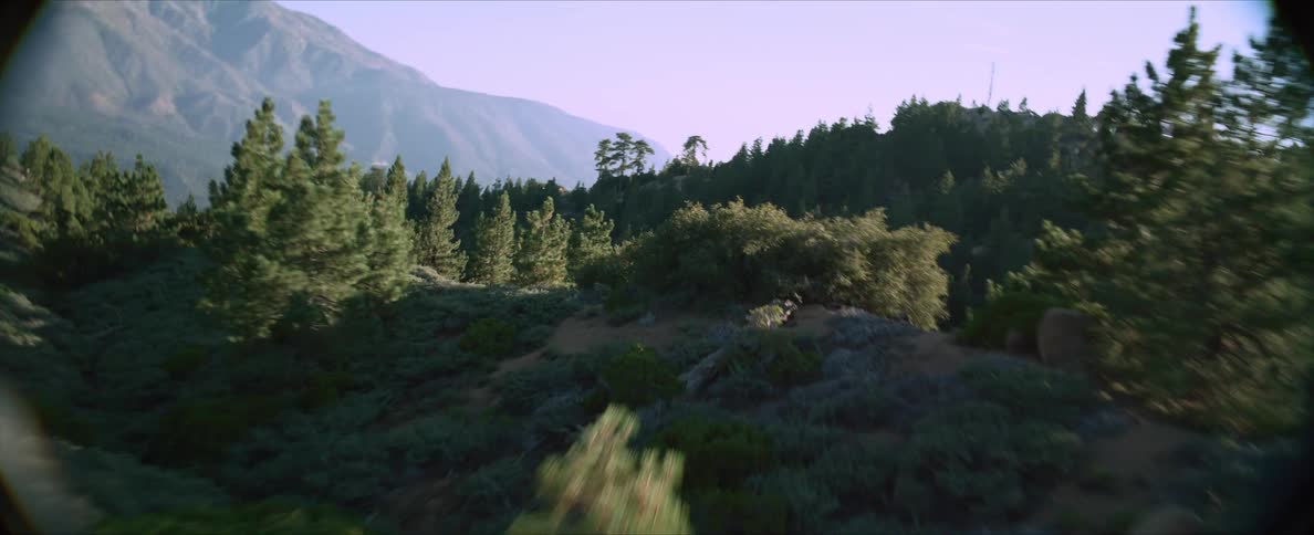 Mountainous aerial scenery with greenish vegetation