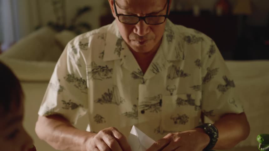 Man making a paper airplane