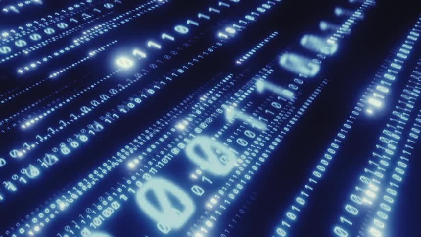 Digitized glowing ones and zeros move across the dark computer screen