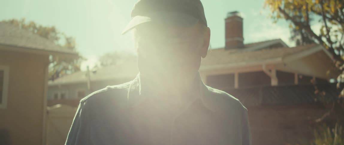 A clip of an elderly man holding a baseball