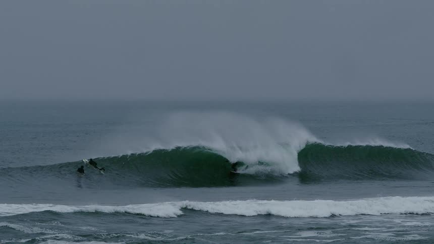 Surfer tube riding a wave