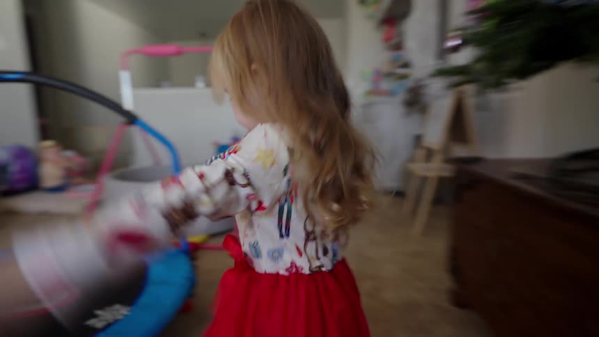 A clip of a girl running around the house