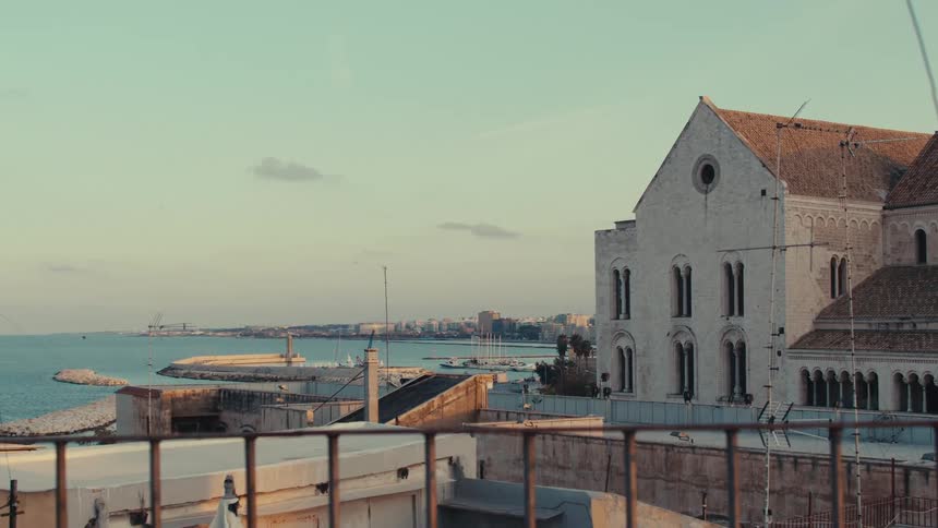 A port is near the city and surrounded by blue water