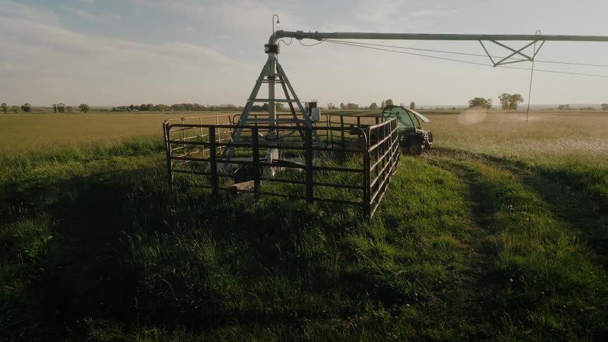 Person in a farm vehicle driving through a field