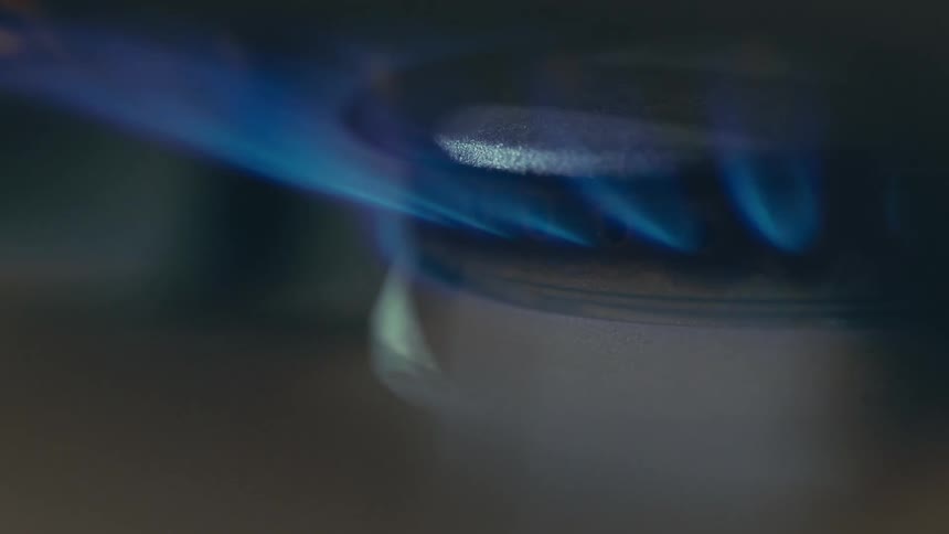 The flames on the burner spark on