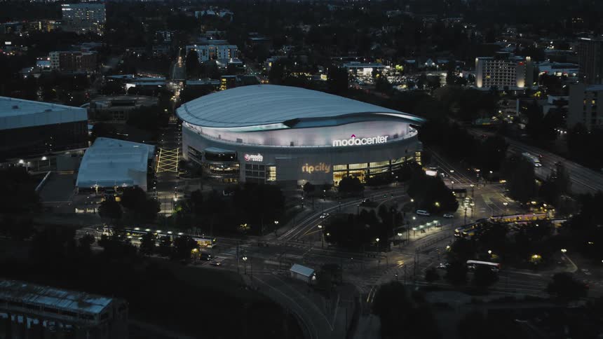 Panorama of a modern stadium illuminated at night in the city