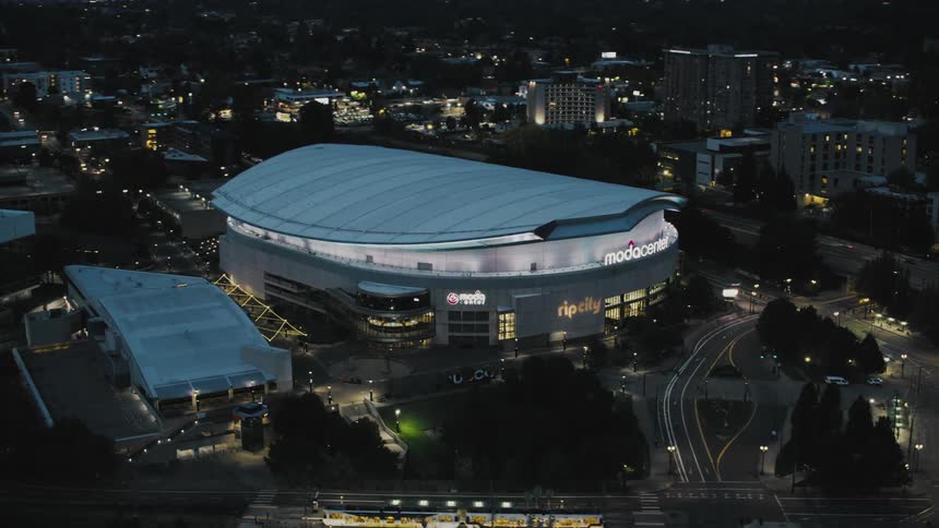 A large sports stadium is in the middle of the city