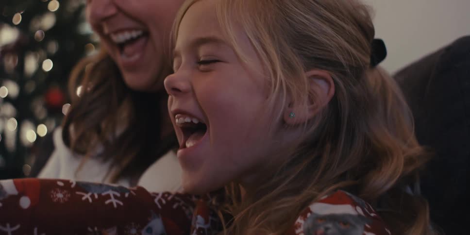 Mother and daughter smiling together