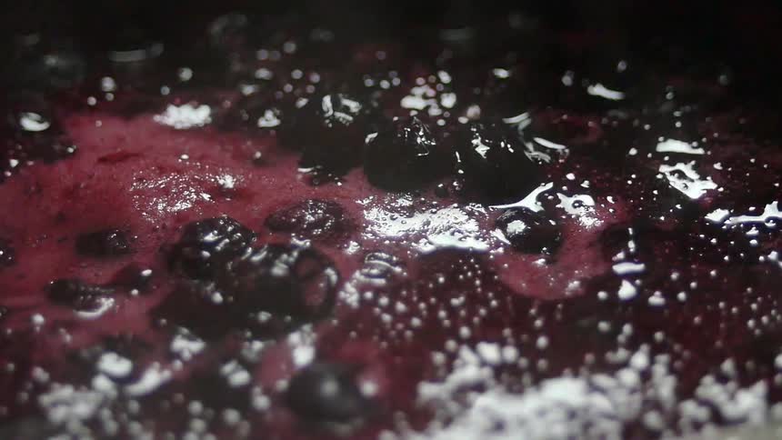 Berries and fluid boil in a pot