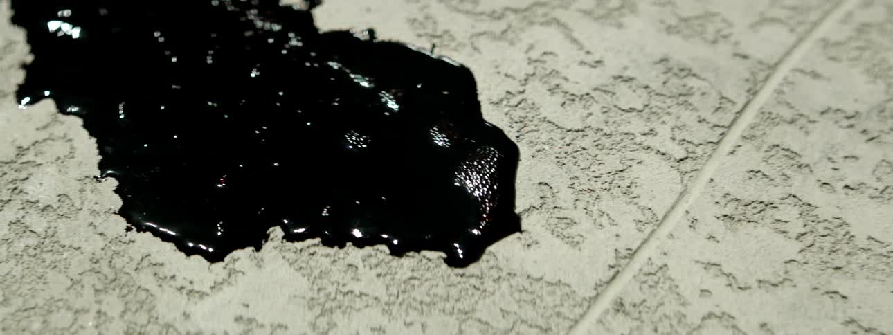 Red liquid spreads over the floor