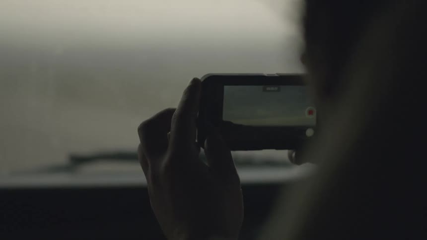 Person in a car takes a picture