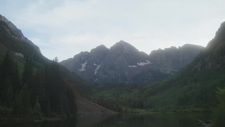 A lake sits before the mountain range