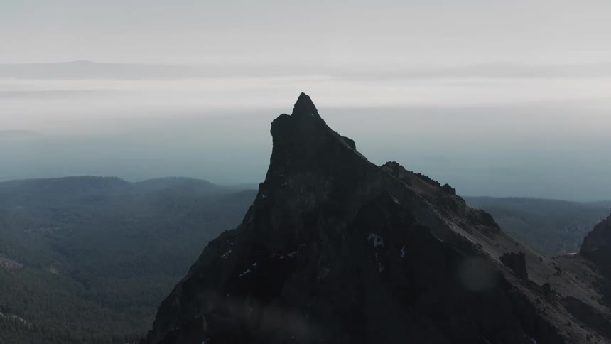Aerial view of a mountain with a steep and high cliff