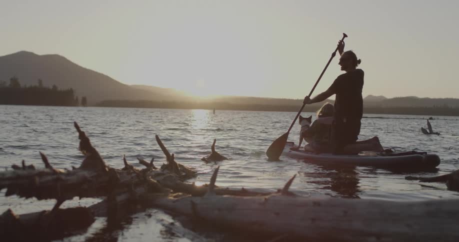 Man paddling kayak out into the water
