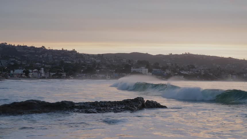 Landscape of a beach with an urban city in the background