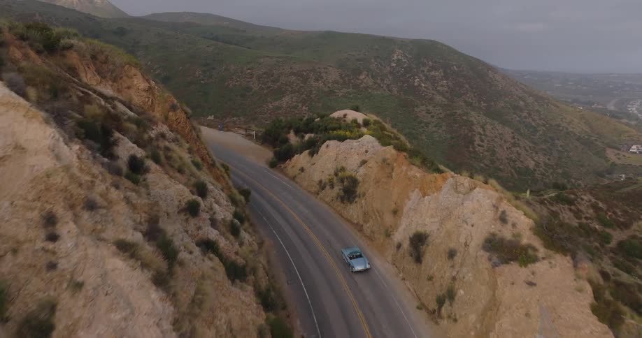 A clip of a car moving round the hill