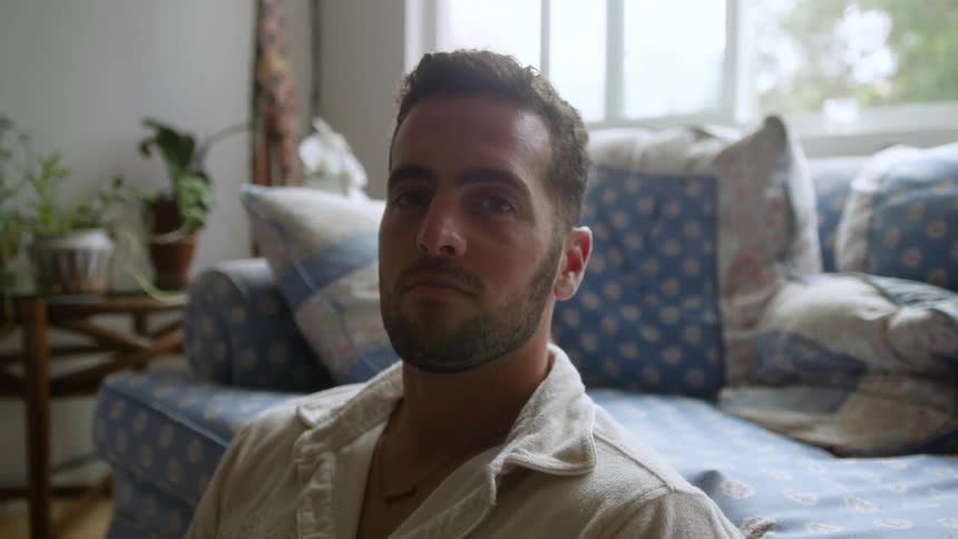 Portrait of a man sitting in a living room