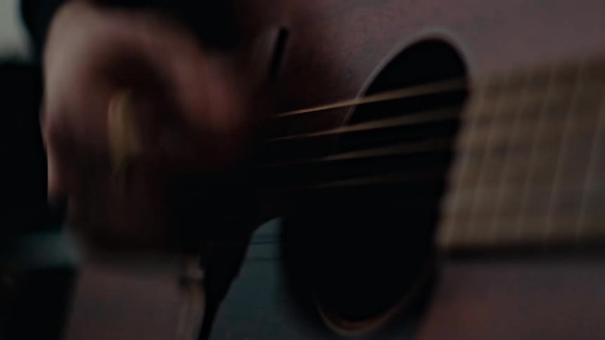 Hand playing guitar