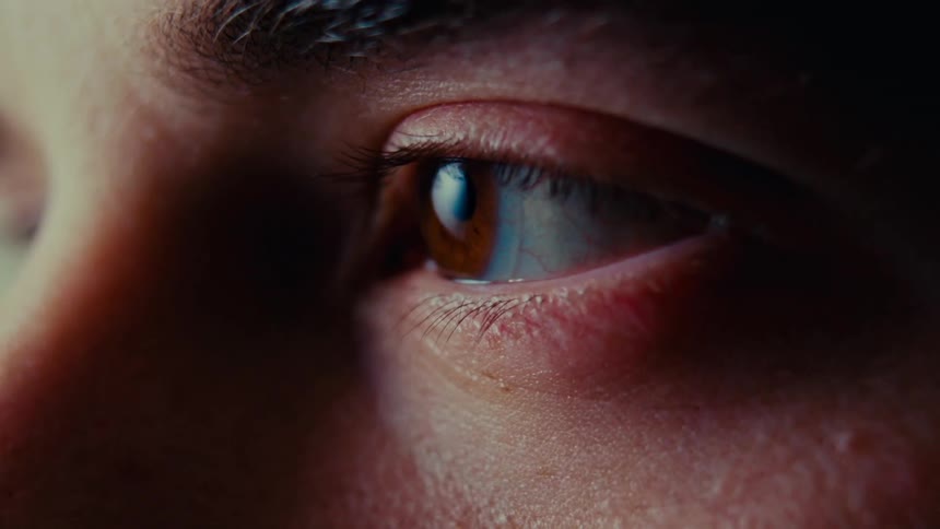 Close up of a man blinking his eye
