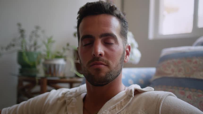 Portrait of a man sitting in the living room