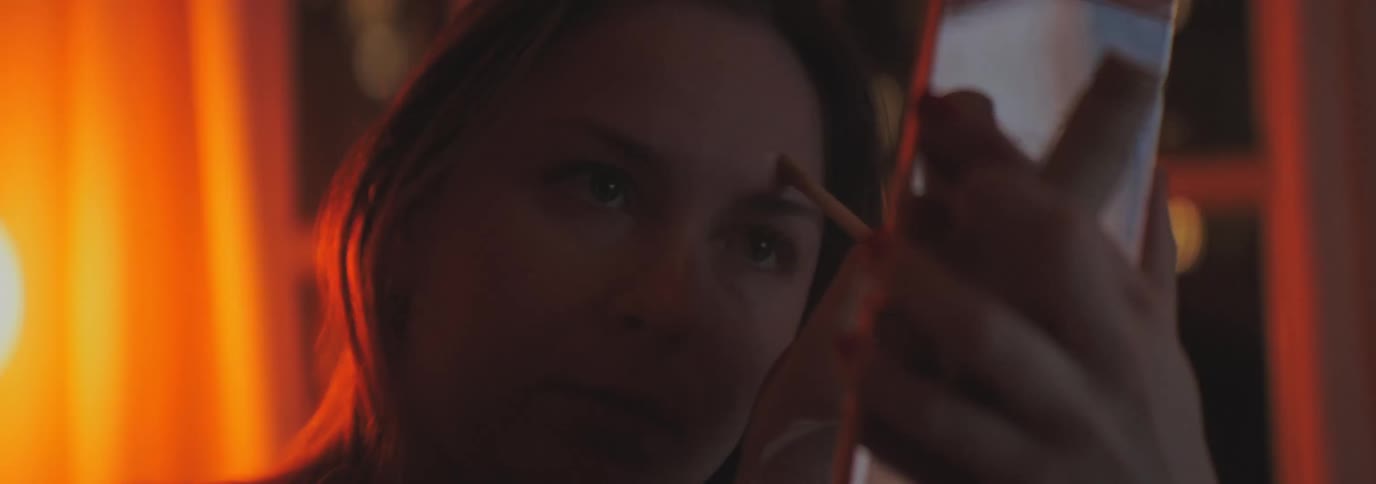 A clip of a lady making up