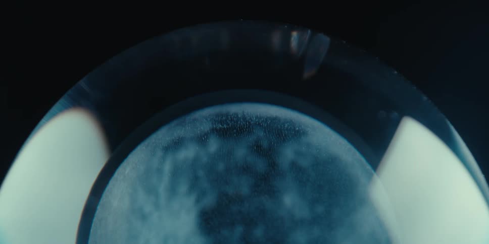 A figure of the moon is inside the orb