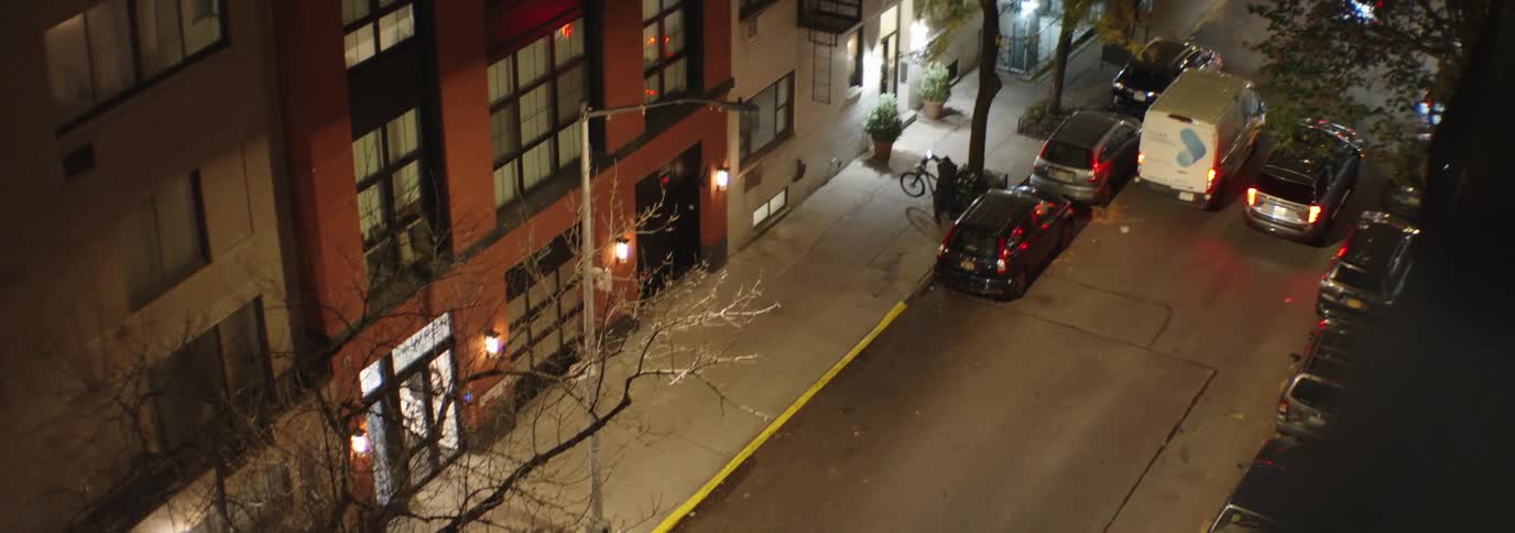 City street at night with vehicle traffic
