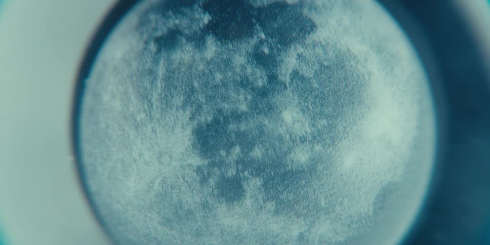 A display shows the side of the moon