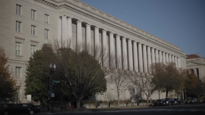 Historic building in an urban city next to a street with vehicle traffic