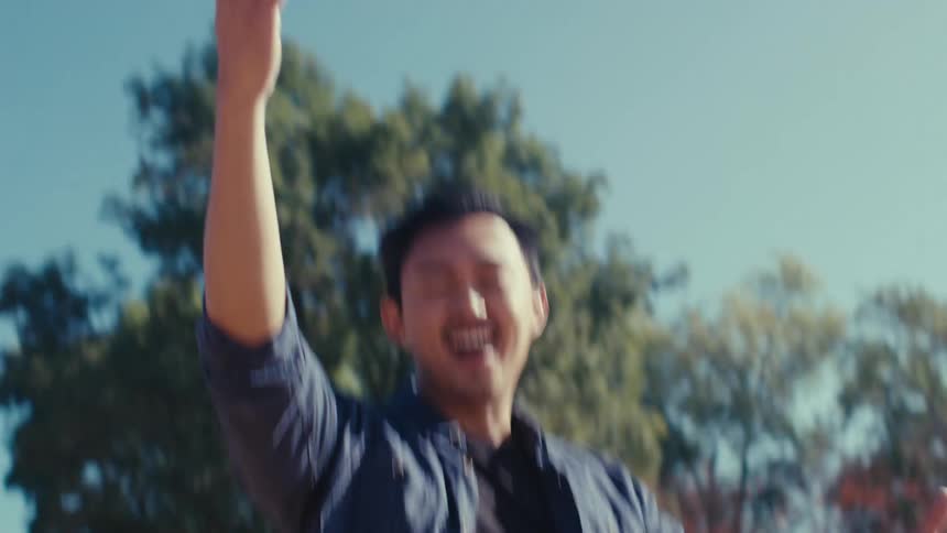 Man on a playground making hand gestures