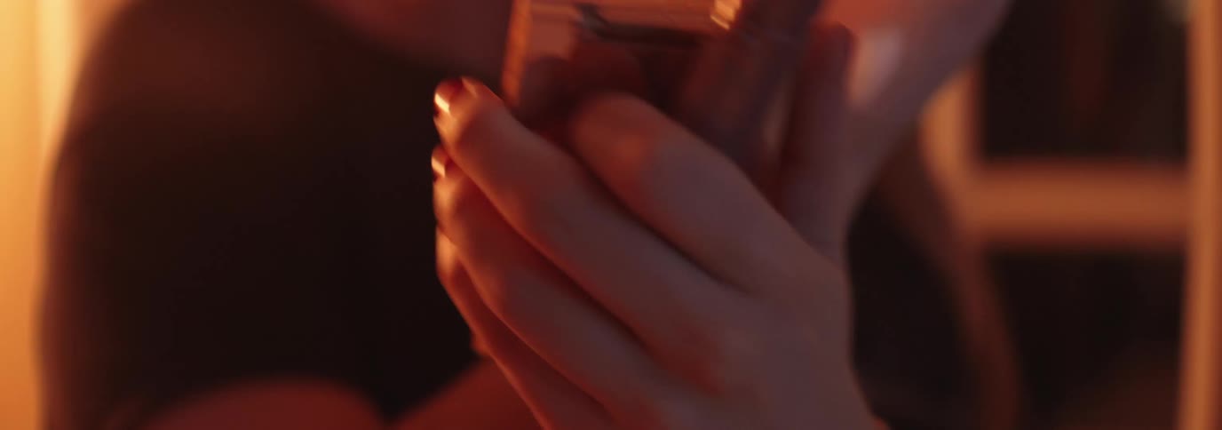 Woman putting on makeup