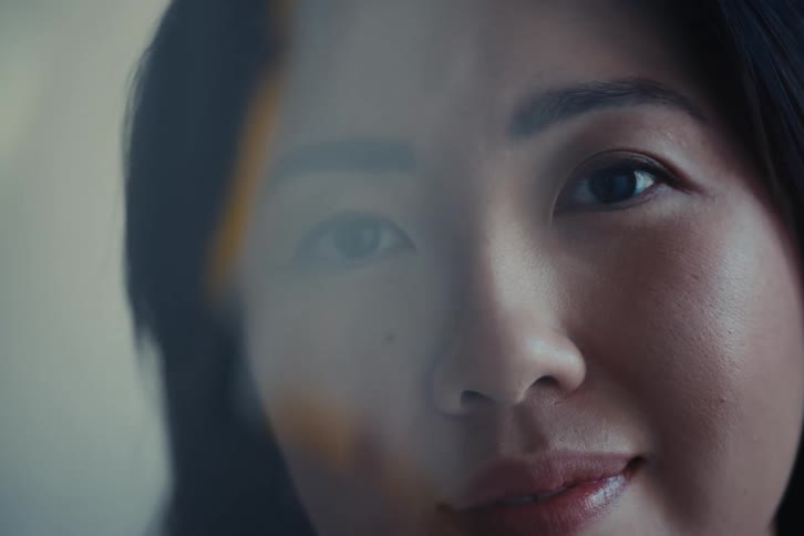Portrait of a woman looking at a picture