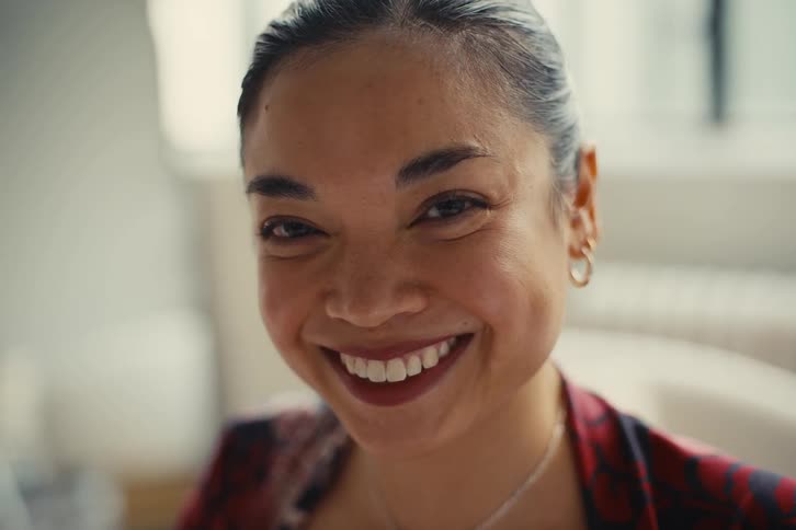 A clip of a happy faced woman