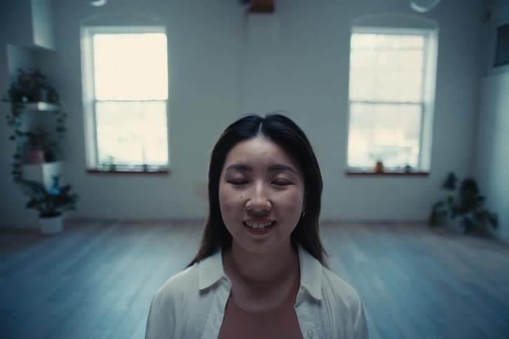 Portrait of a woman with happy facial expression in a room