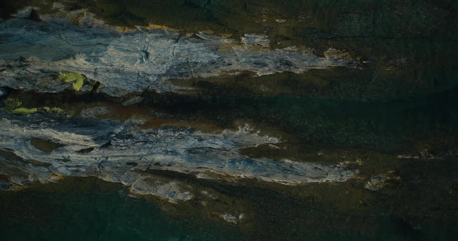 Water is flowing over the large rocks