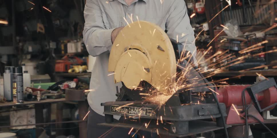 A clip of a welder cutting iron