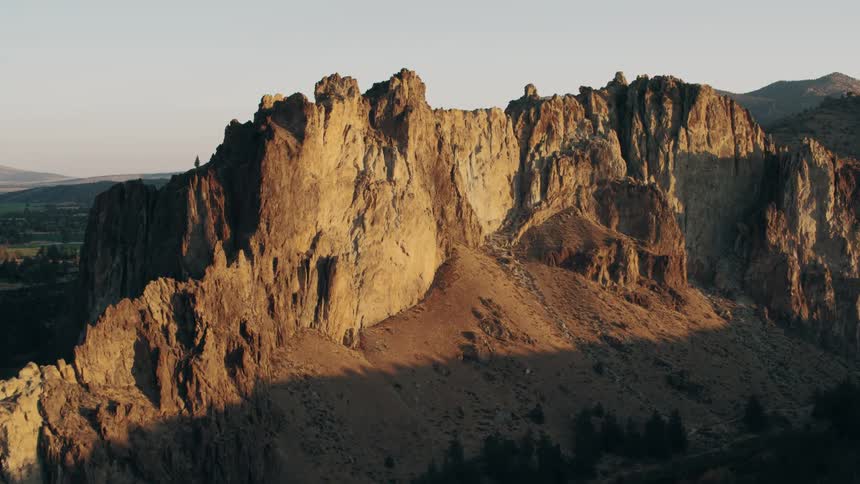 A mountain is at the end of the field
