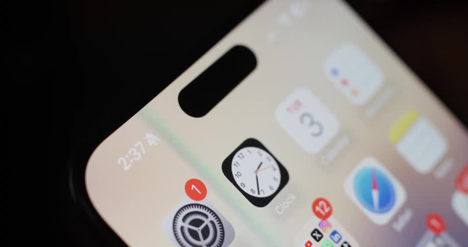 Closeup view of a smartphone screen showing various app icons and notifications